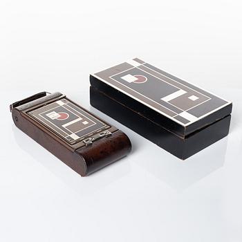 Walter Dorwin Teague, a folding camera in in a lacquered case, USA 1930s.