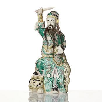 A famille verte bisquit figure of a warrior, Qing dynasty, 19th century.