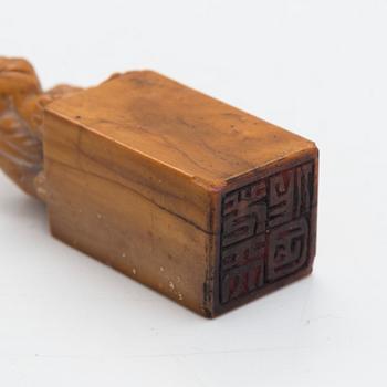 Two pieces of carved agalmatolite, sculpture and seal,one with stamp. China, mid-20th century.