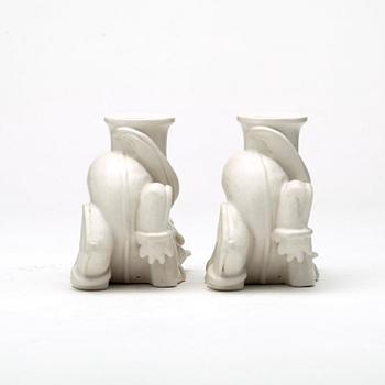 Wilhelm Kåge, a set of stoneware figures of a 'dragon puppy' and two 'dragon puppies' with candle holders, Gustavsberg, ca 1940.