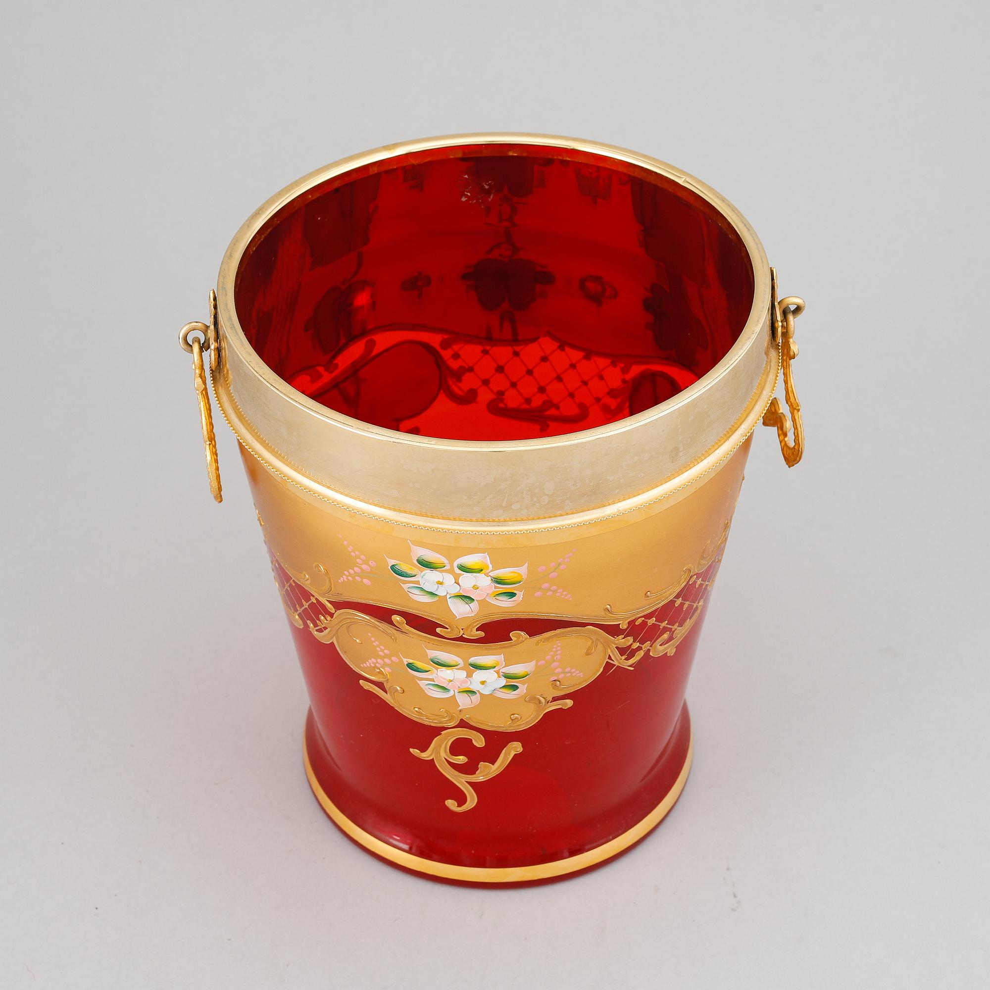 A red glass wine cooler.