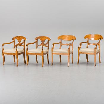 A set of four mid 19th century arm chairs.