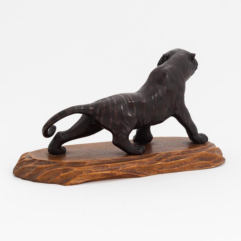 A bronze okimono/sculpture in the shape of a tiger, first half of the 20th Century.
