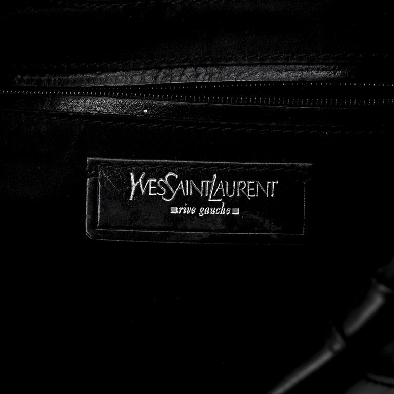 YVES SAINT LAURENT, a black leather shoulder bag.