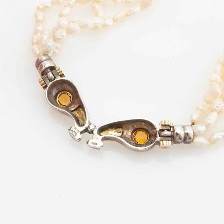 Tonino Lamborghini, Necklace of cultured pearls with a pendant of 18K gold, silver, and faceted citrines.