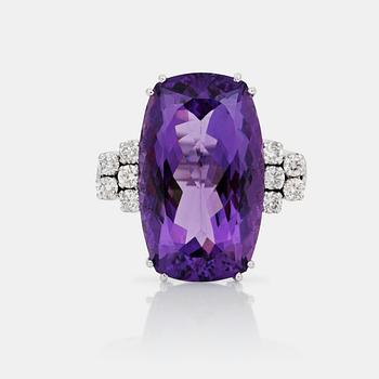 720. An amethyst, circa 19 cts, and diamond ring.