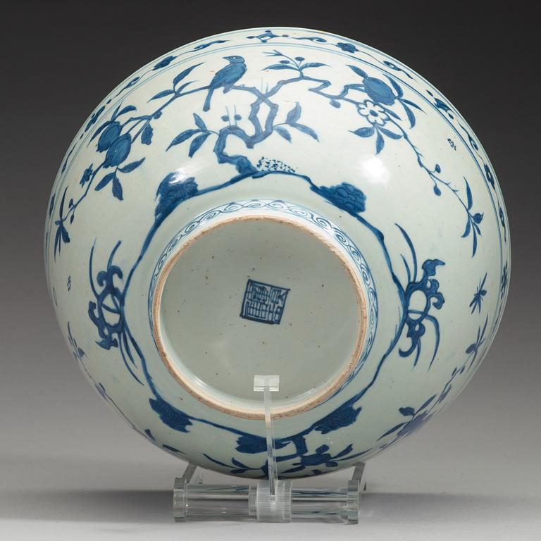 A large blue and white 'parrot and pomegranate' bowl, Ming dynasty (1368-1644).