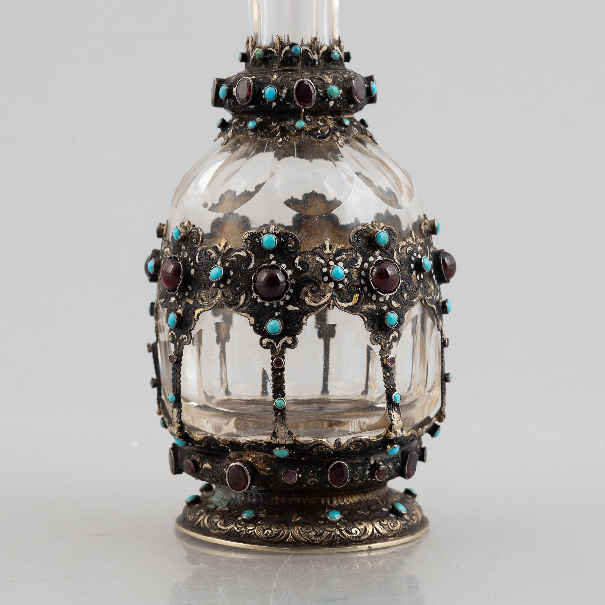 Flask with stopper, glass with mounts of partially gilded silver, late 19th century.