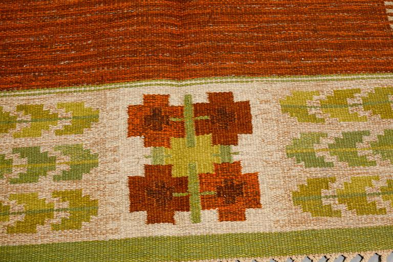 A flat weave by Berit Woelfer, signed BW, third quarter of the 20th century, 238 x 197 cm.