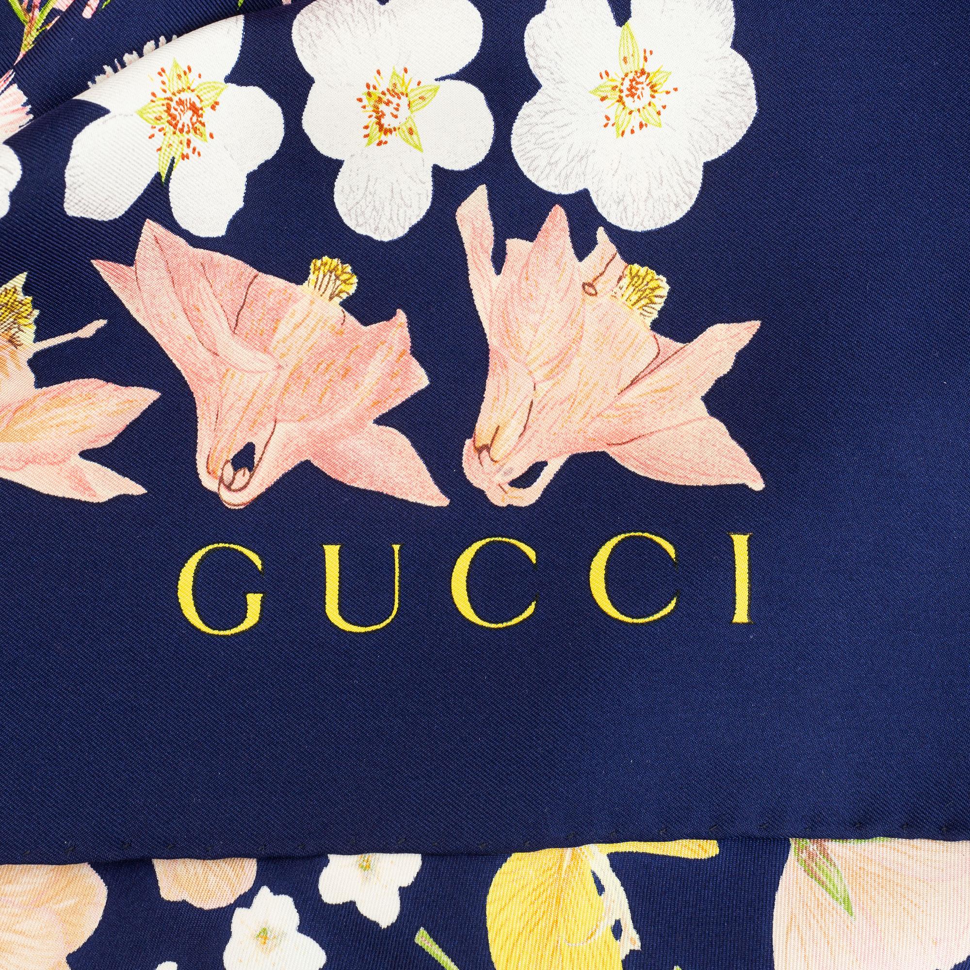 Gucci, a silk scarf.