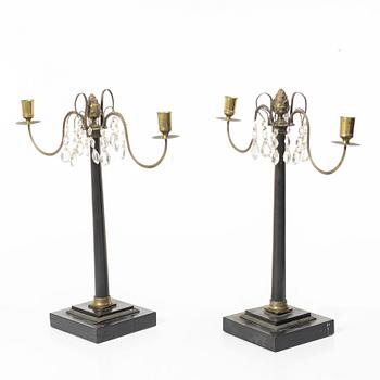A pair of wooden candelabras, around 1900.