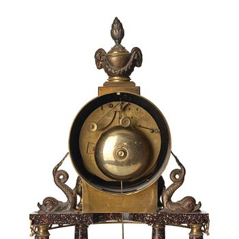 A late Gustavian-style porphyry portico clock.