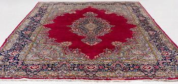 A Kirman carpet, signed, c. 388 x 279 cm.
