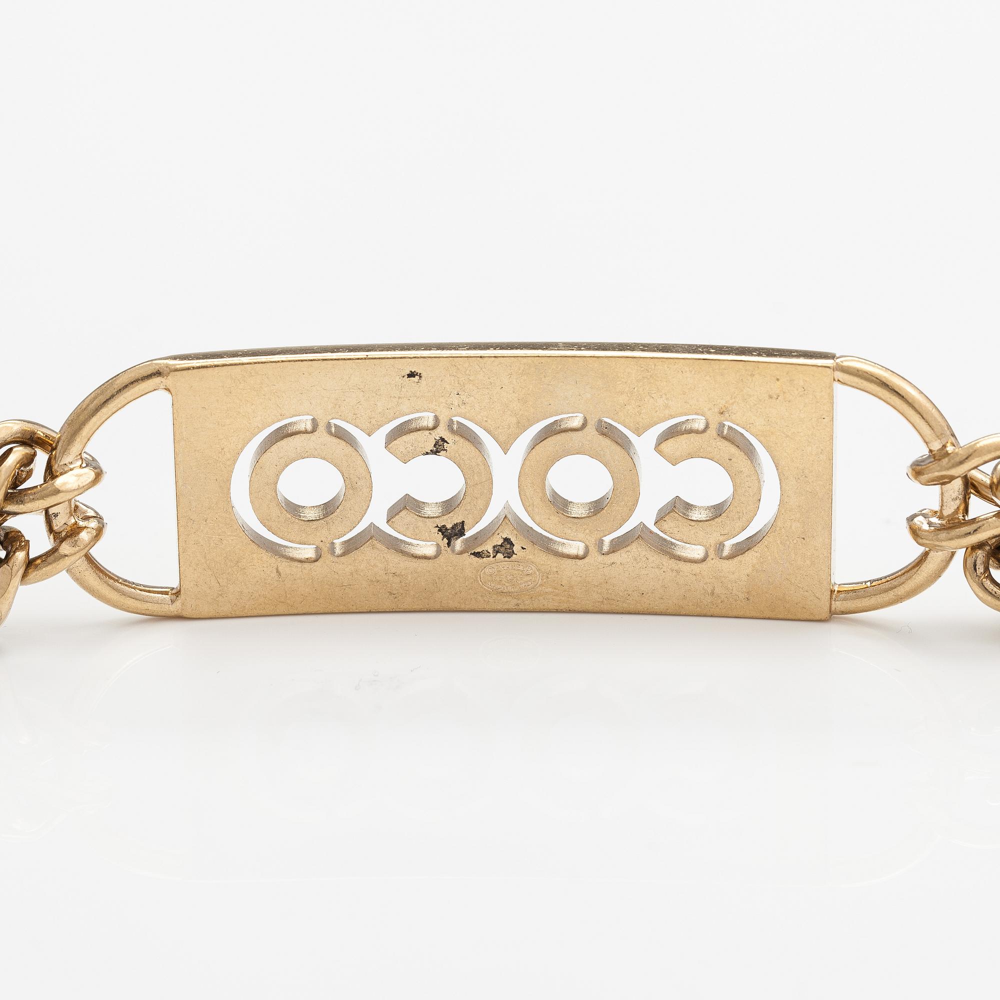 Chanel, A gold coloured metal chain belt with pink stones. Marked "CHANEL 02 CC P MADE IN ITALY".