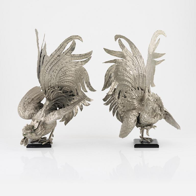 A pair of metal table decorations, 20th century.