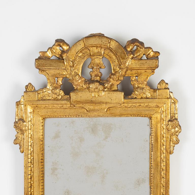 A Gustavian mirror by Johan Åkerblad, master in Stockholm 1758-99), signed.