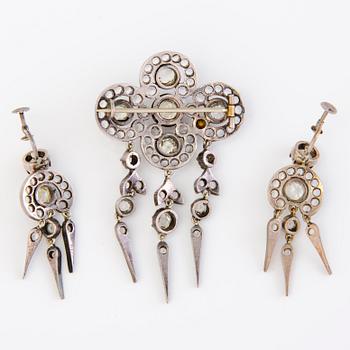 A set of silver earrings and a brooch with glass gems so called "Paste jewelry" Late 19th century.