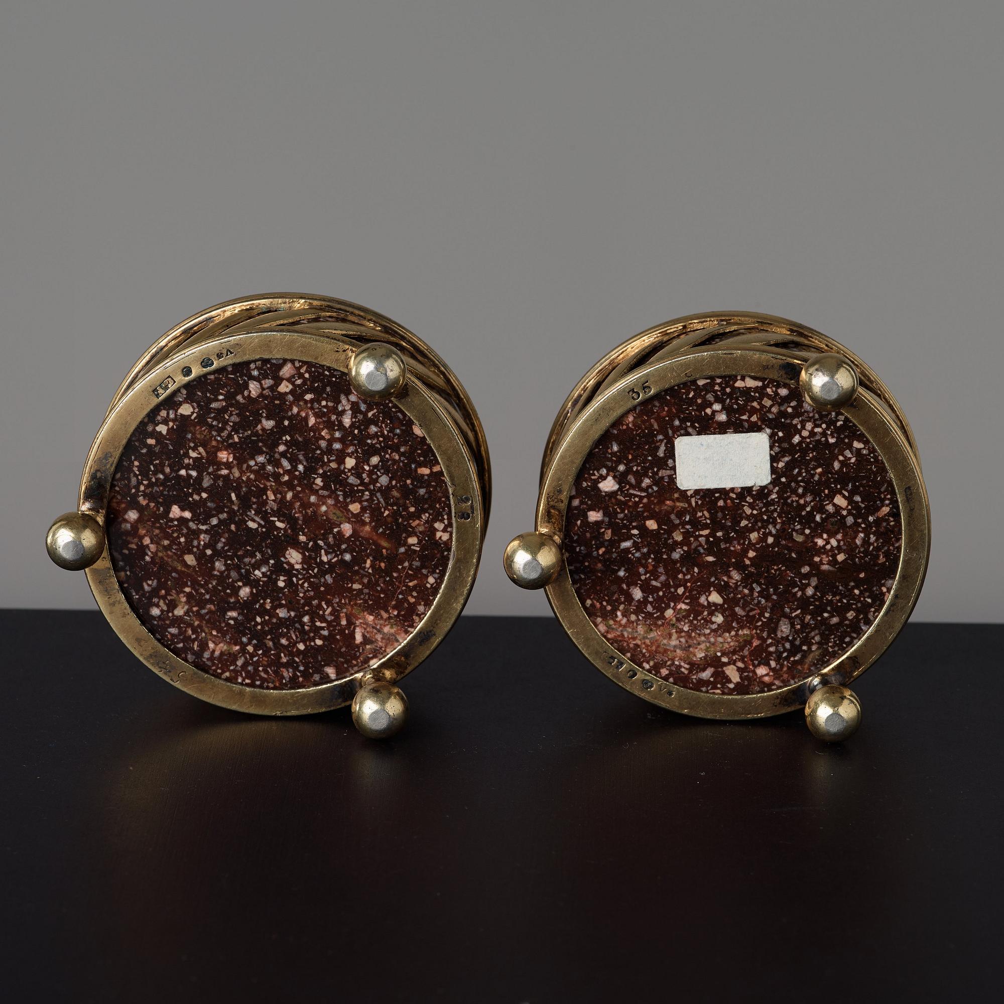 A pair of gilt silver and porphyry salts, by Gustaf Folcker, Stockholm 1827.