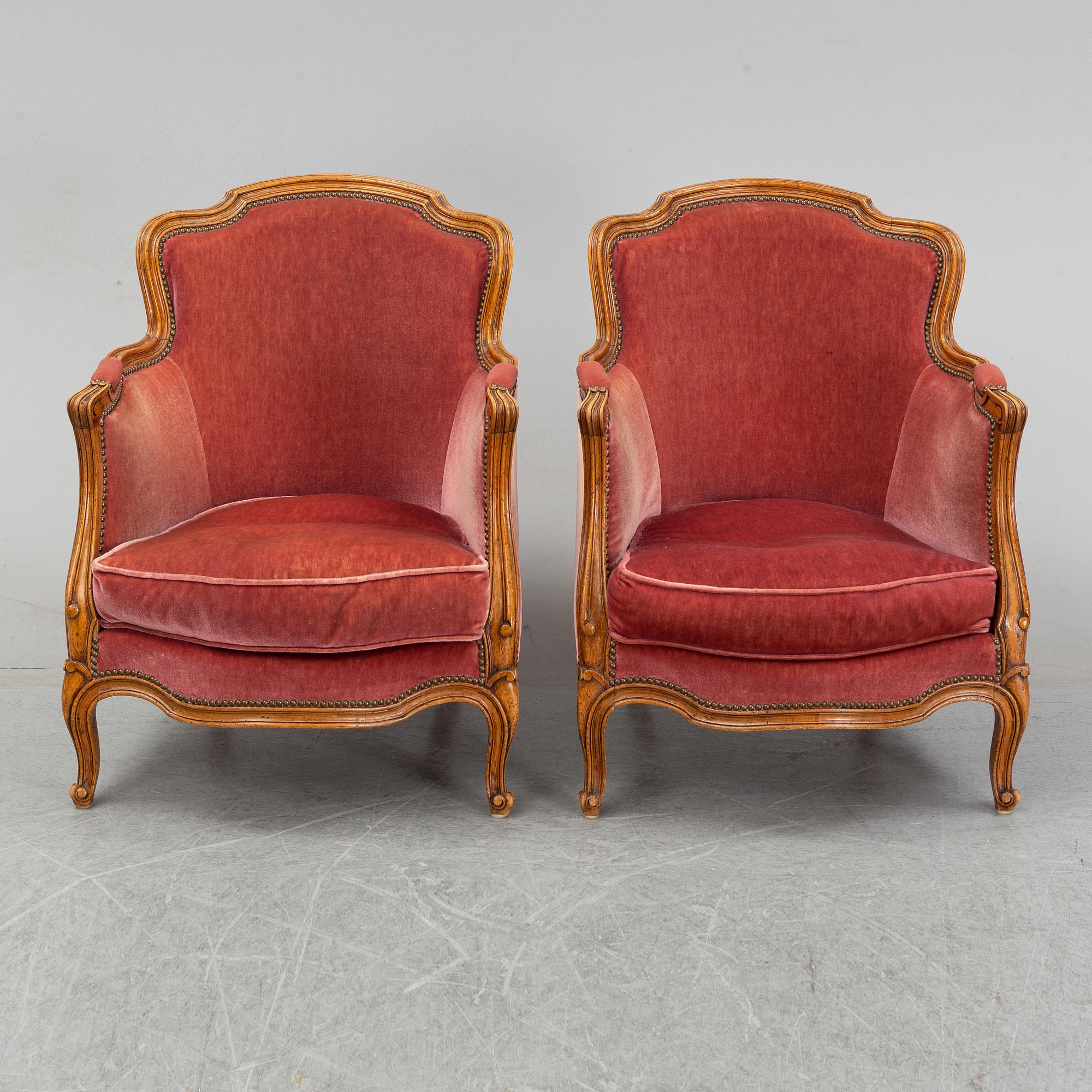 A pair of rococo style easy chairs from around the year 1900.
