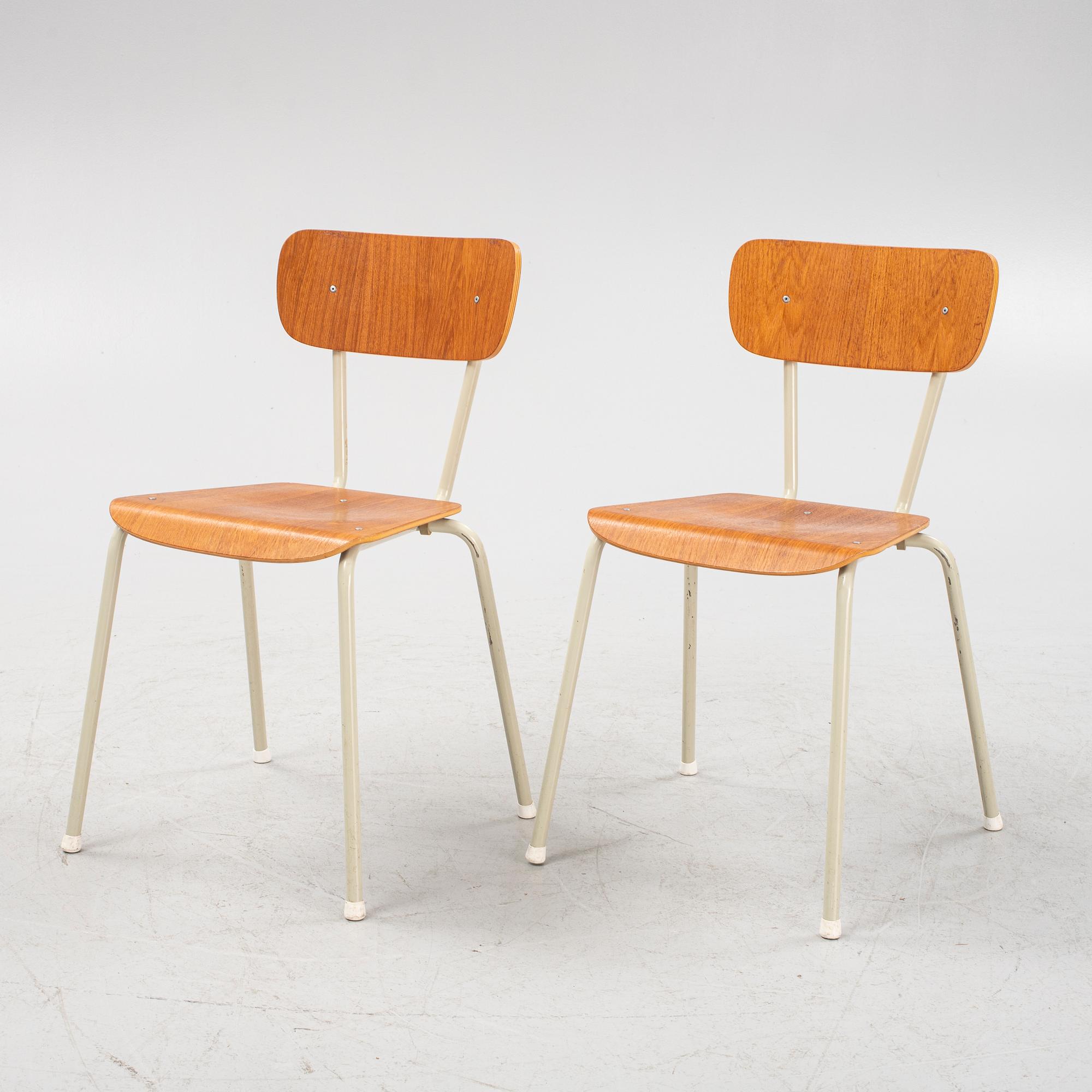 Eight teak veneered chairs, second part of the 20th Century.