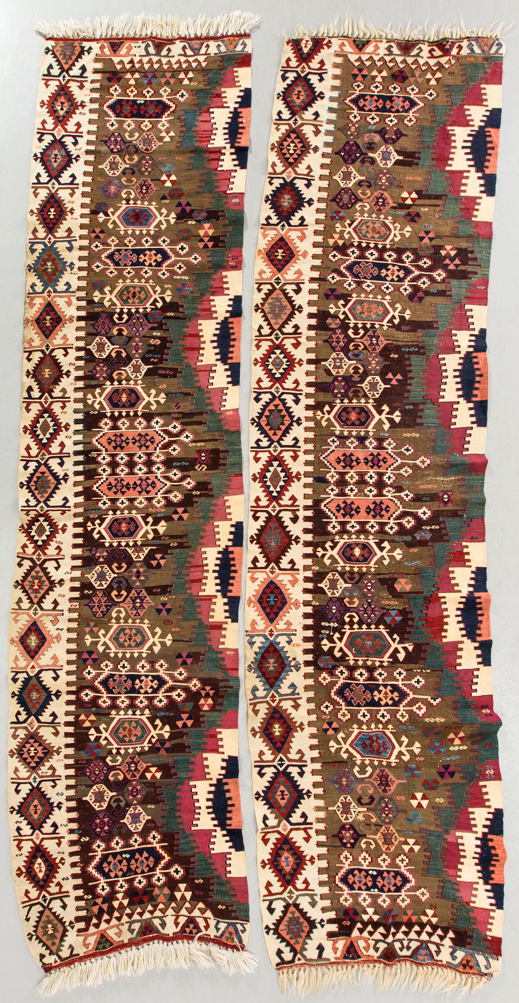 A pair of Anatolia antique Kilims ca 340 x 86 cm each.