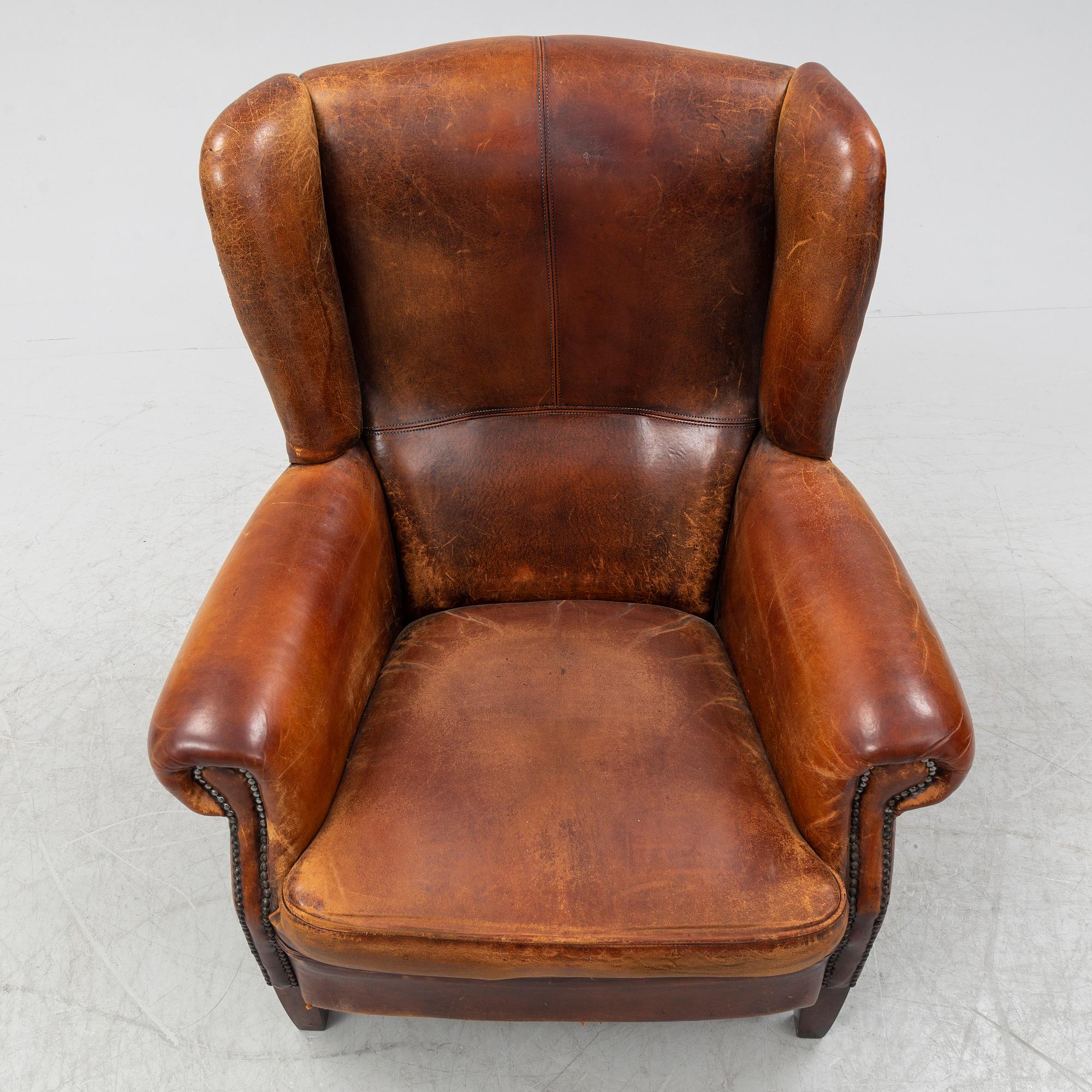 A leather upholstered easy chair , second half of the 20th Century.