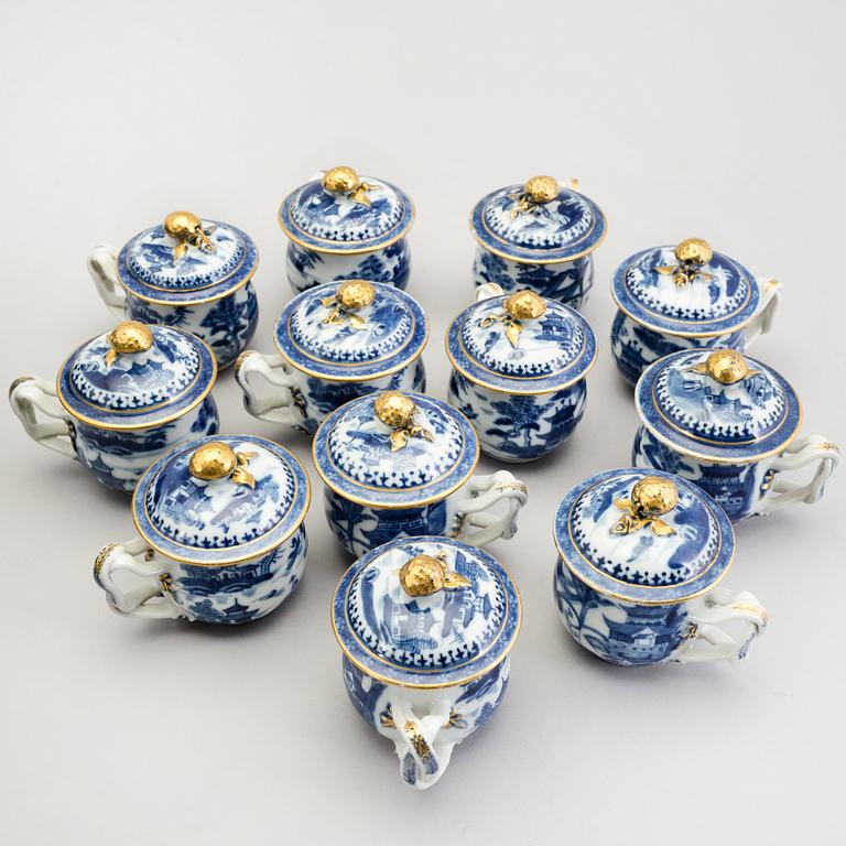 A set of twelve Chinese early 19th century export porcelain custard cups with lids.