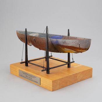 Bertil Vallien, a sand cast glass sculpture of a boat, Kosta Boda, Sweden.
