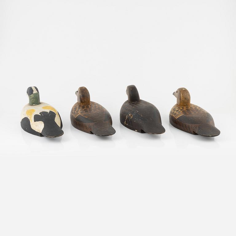 Four wooden decoy ducks, 20th century.