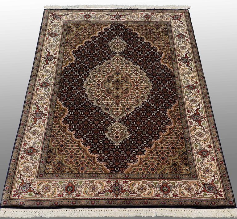 An oriental rug, around 150 x 105 cm.