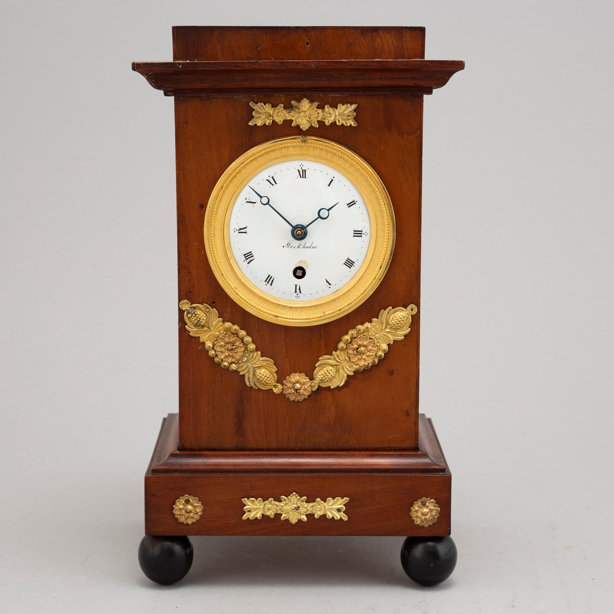 An Empire mantel clock, early 19th Century.