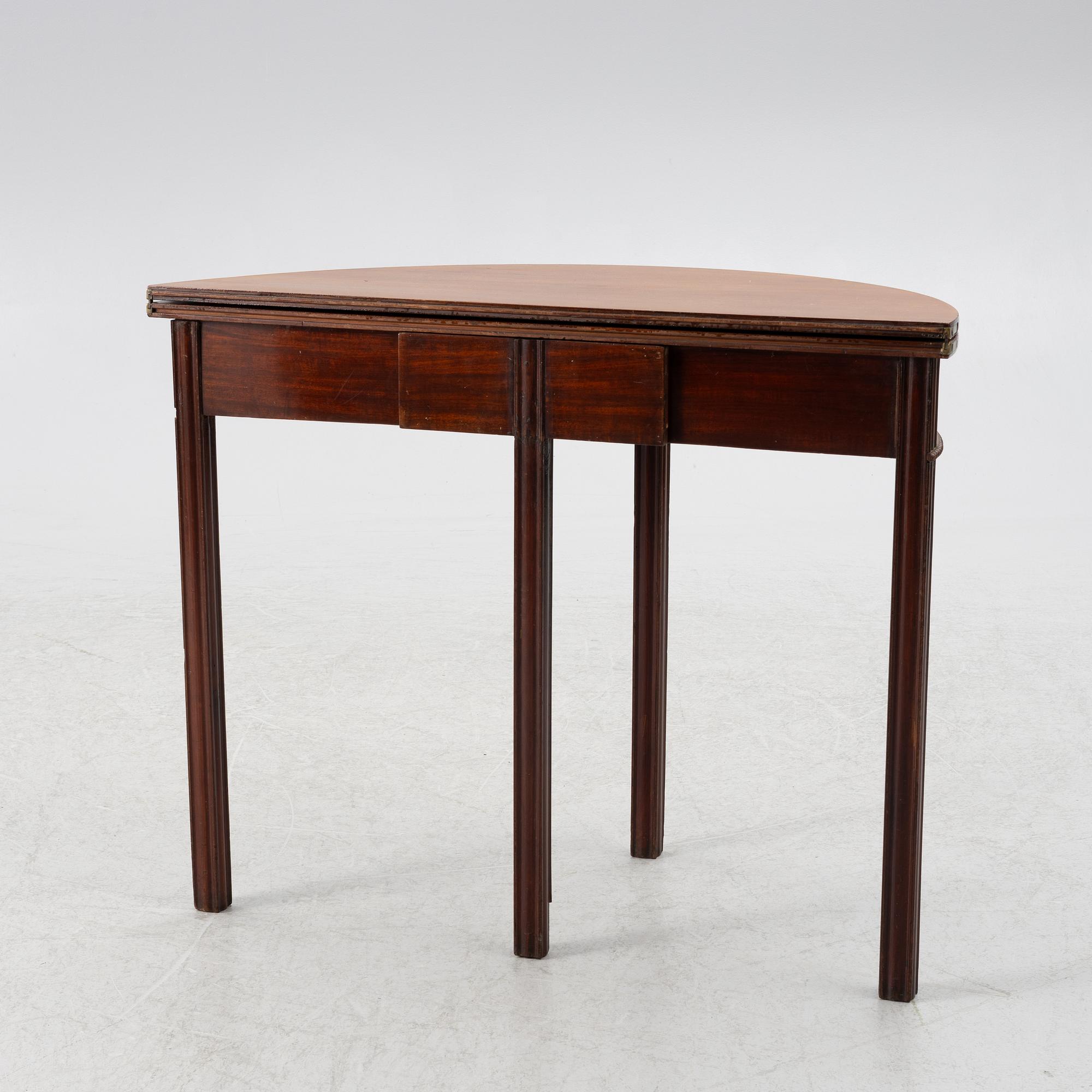 A late Gustavian mahogany games table by J. F. Wejssenburg (master in stockholm 1795-1837).