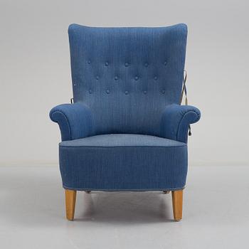 A mid 20th century armchair, possibly designed by Carl Malmsten.