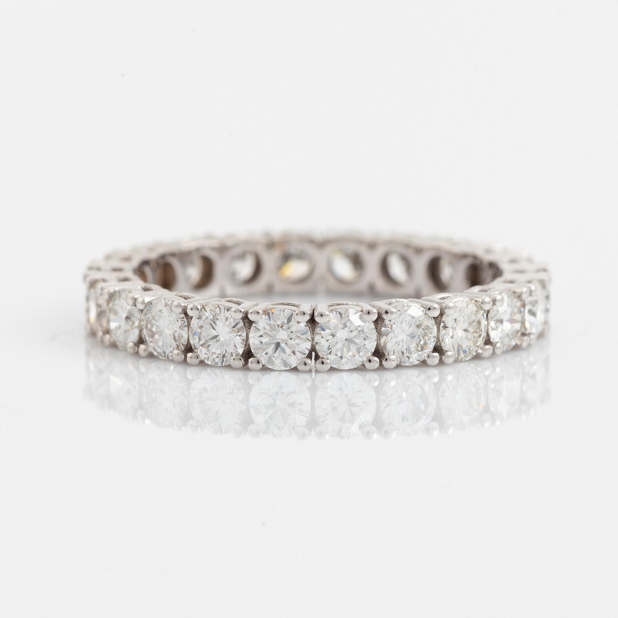 Brilliant cut diamond eternity ring.