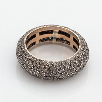 Silver and diamond ring.