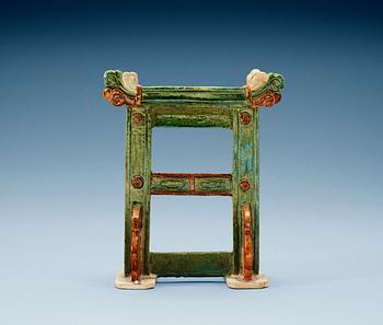 A green and brown glazed pottery stand/gate, Ming dynasty (1368-1644).