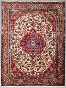 A carpet from Tabriz, around 388 x 294 cm.
