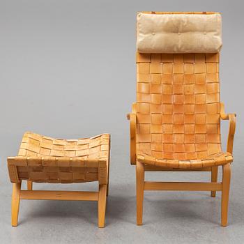 BRUNO MATHSSON, an easy chair and ottoman, Firma Karl Mathsson, Värnamo, 1978.