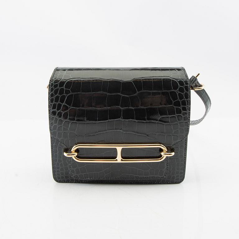 Hermès, bag "Green Shiny Alligator Mini Roulis 18 Permabrass Hardware" 2021.