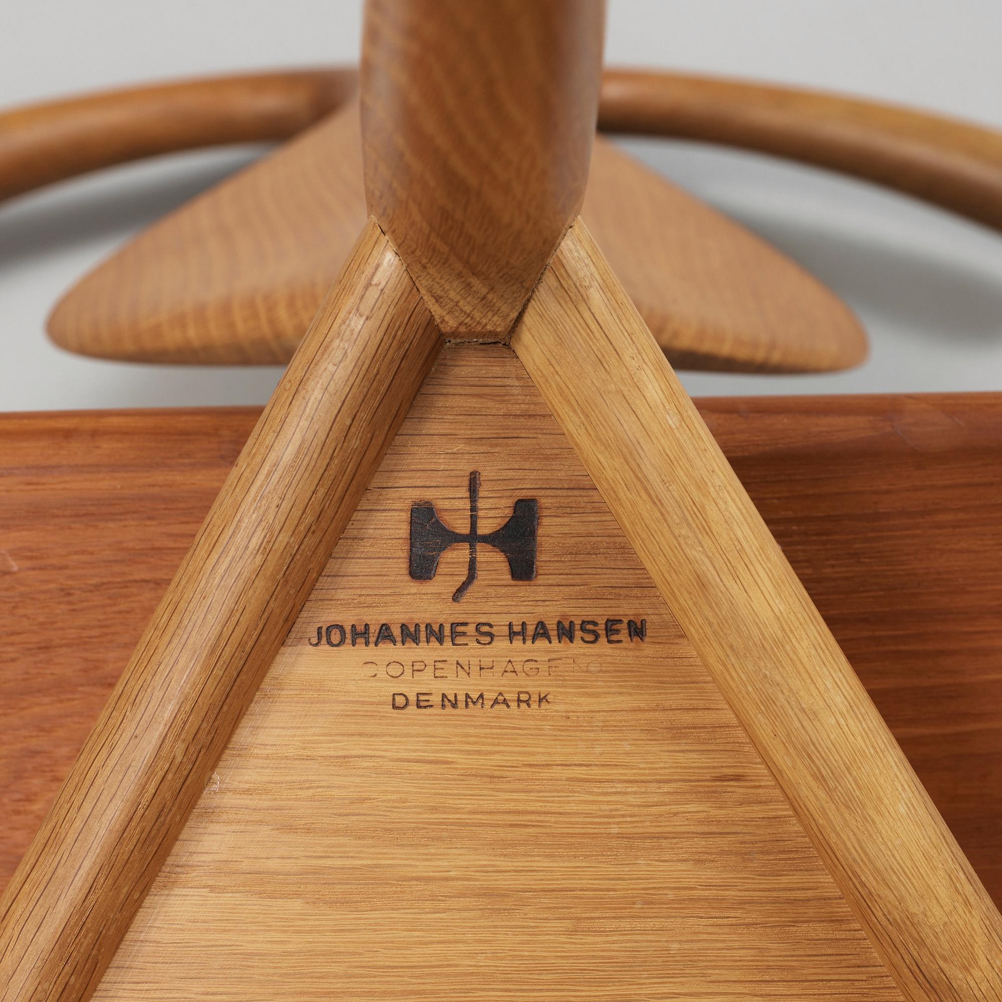 A Hans J Wegner 'Jakkens Hvile' teak chair, Johannes Hansen, Denmark.