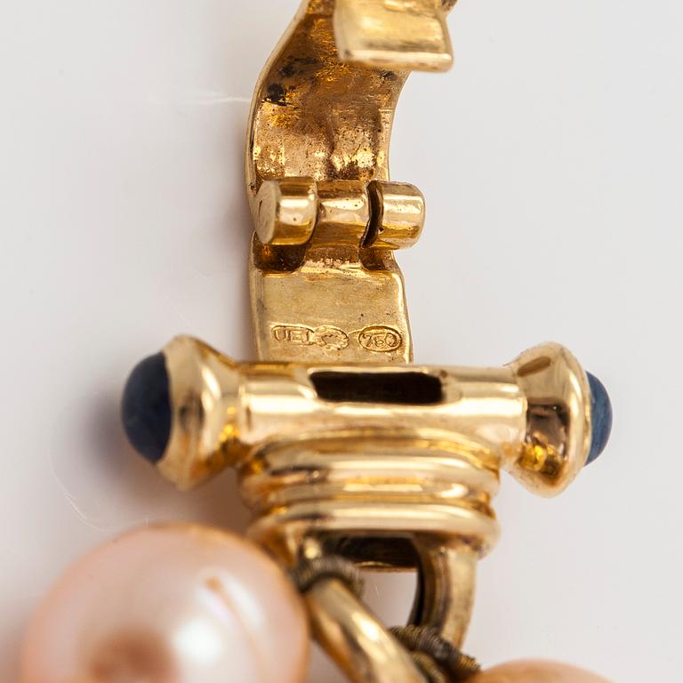 A cultured saltwater and freshwater pearl bracelet, 18K gold and cabochon-cut sapphires. Finnish import hallmarks.
