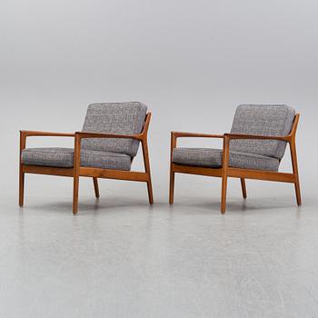 A pair of USA 75, teak lounge chairs by Folke Ohlsson for Dux.