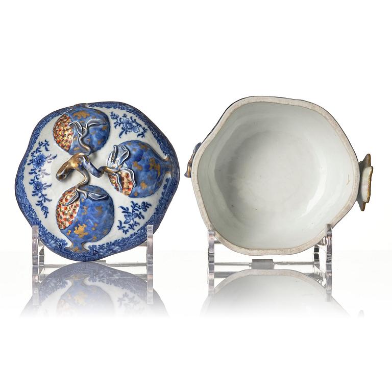 A Chinese blue and white 'pomegranate' tureen with cover and stand, Qing dynasty, Qianlong (1736-95).