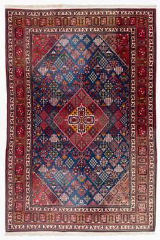 An oriental carpet, c. 360 x 240 cm.