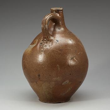 A large salt-glazed stoneware 'Bartman jug', 17th Century.