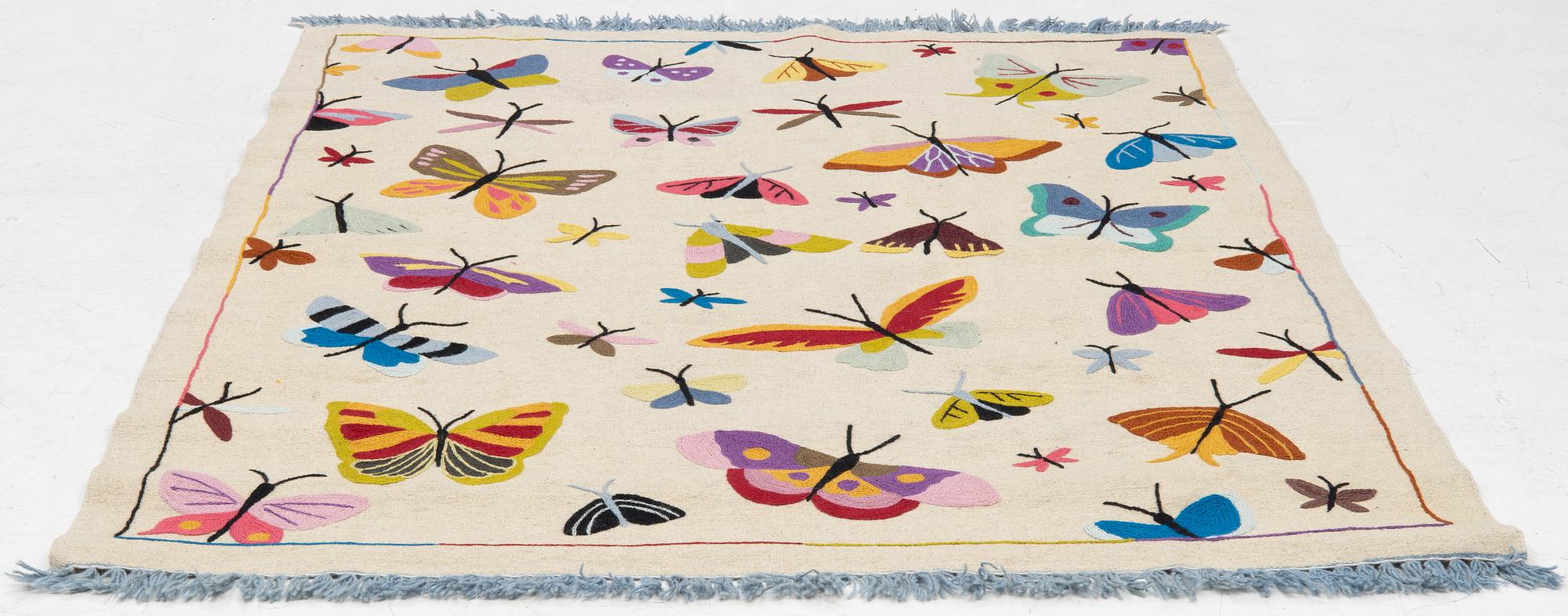 A hand-embroidered kilim carpet, c. 195 x 148 cm.