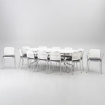 Vico Magistretti, a "Shine" dining table with twelve chairs, De Padova, Italy, around the year 2000.