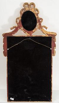 A bronzed gustavian style mirror from the second half of the 20th century.