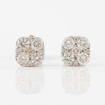A pair of earrings in 18K white gold set with round brilliant-cut diamonds.