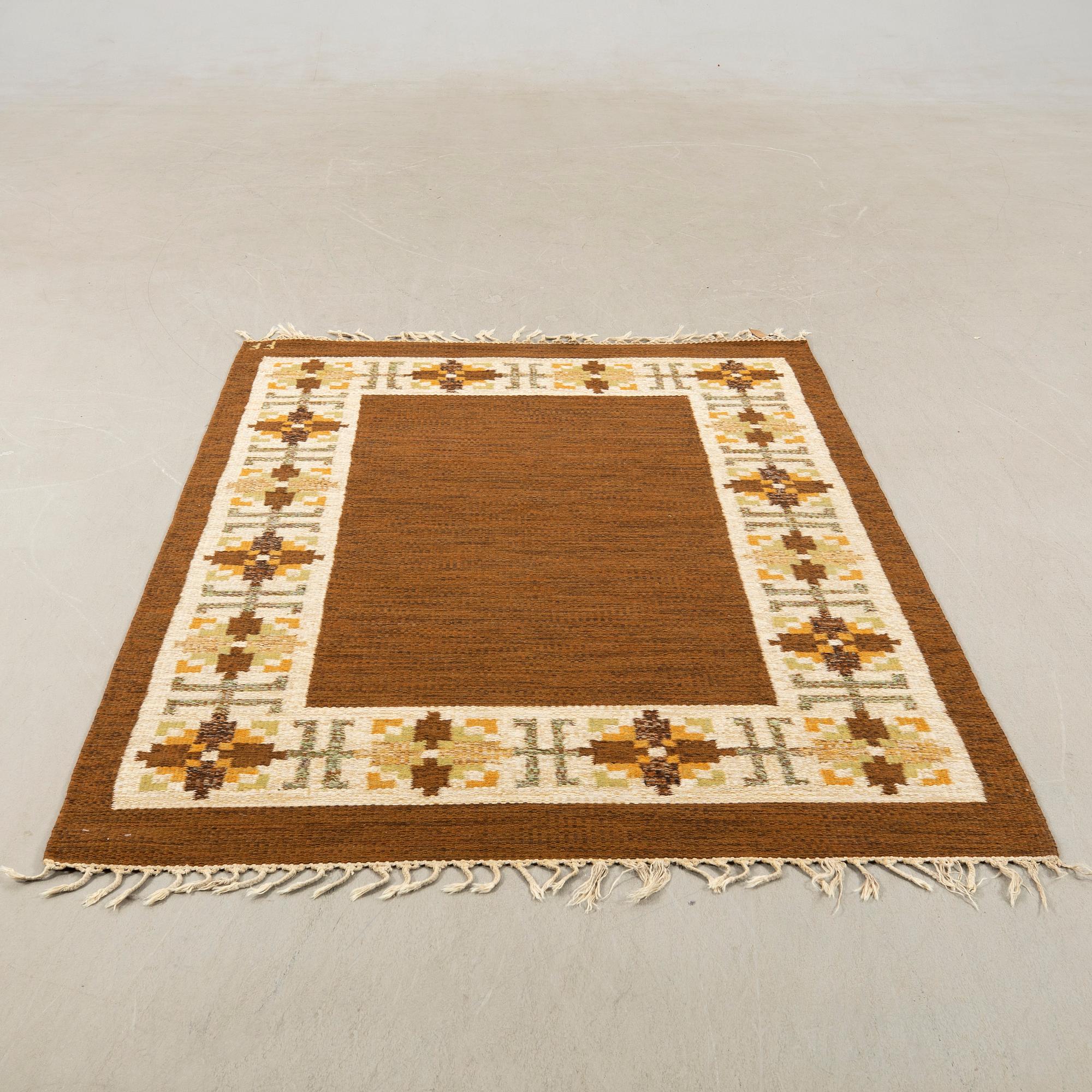 Rug flat weave signed FF (Swedish design: the company AB Fredrik Fiedler) woven in Portugal, approximately 202x136 cm.